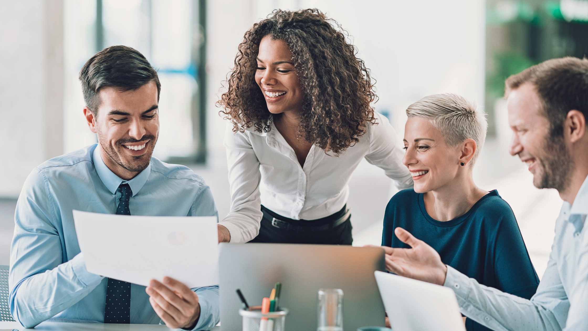 Executive Coaching. Four Executives Working Together.